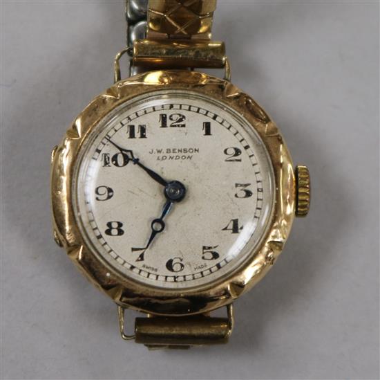 A ladys 9ct gold J.W. Benson manual wind wrist watch on a gold plated flexible bracelet.